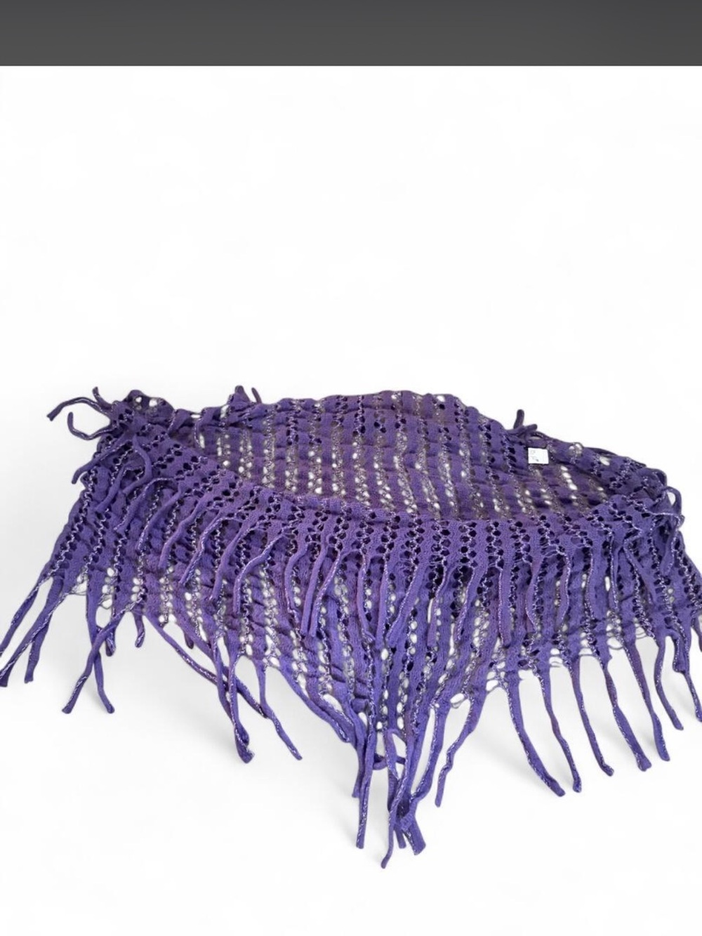 Purple crocheted infinity scarf with fringe